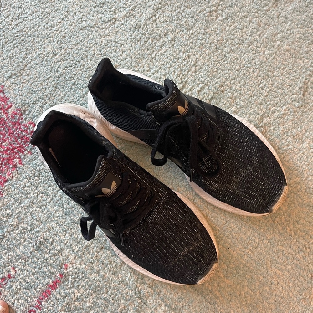 Adidas black and gold size 9 fabric is distressed on top as photographed